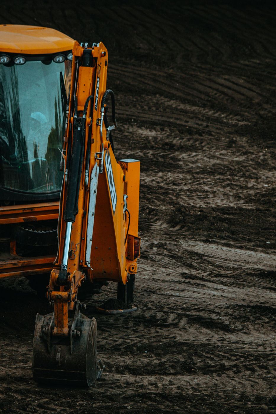 Excavator preparing earth at a construction site